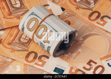 A lot of fifty euros and one hundred dollars bills background Stock Photo