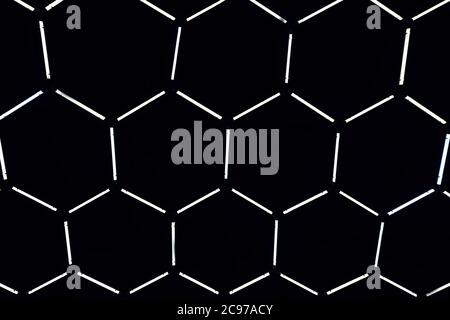 Abstract dark background in the form of glowing cells Stock Photo