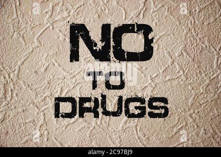 No to drugs written on grunge wall background. Addictions healthcare concept Stock Photo