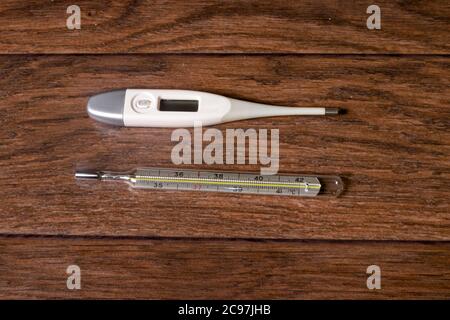 Digital Thermometer High Temperature On Wooden Stock Photo