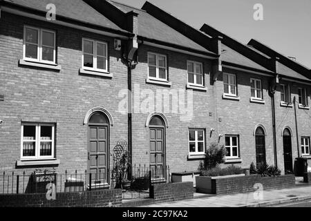 Modern new terraced houses in Docklands London England UK black and white monochrome image stock photo Stock Photo