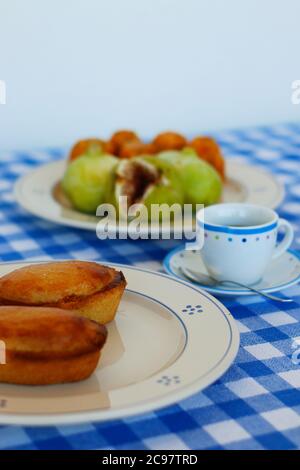 Breakfast in Salento, with typical products of the southern Italian tradition: Prickly pears, figs and Pasticciotto with cream on ceramic plates and w Stock Photo