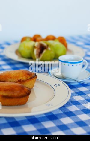Breakfast in Salento, with typical products of the southern Italian tradition: Prickly pears, figs and Pasticciotto with cream on ceramic plates and w Stock Photo