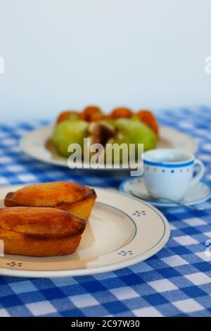 Breakfast in Salento, with typical products of the southern Italian tradition: Prickly pears, figs and Pasticciotto with cream on ceramic plates and w Stock Photo