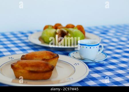 Breakfast in Salento, with typical products of the southern Italian tradition: Prickly pears, figs and Pasticciotto with cream on ceramic plates and w Stock Photo