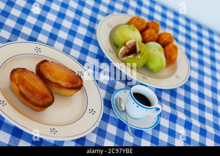 Breakfast in Salento, with typical products of the southern Italian tradition: Prickly pears, figs and Pasticciotto with cream on ceramic plates and w Stock Photo