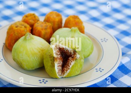 Breakfast in Salento, with typical products of the southern Italian tradition: Prickly pears, figs and Pasticciotto with cream on ceramic plates and w Stock Photo