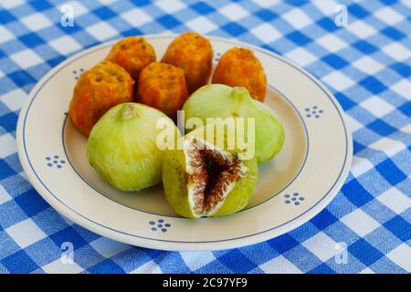 Breakfast in Salento, with typical products of the southern Italian tradition: Prickly pears, figs and Pasticciotto with cream on ceramic plates and w Stock Photo