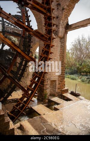 Close up image of historic water wheels in Hama, Syria These are large mechanical wooden wheels called norias. They take water from orontes river and Stock Photo
