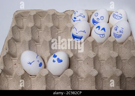 Funny chicken eggs. Smiley eggs with faces, funny faces. Eggs with different emotions: laughter, smiles, fear, anger, scream, tears. Stock Photo