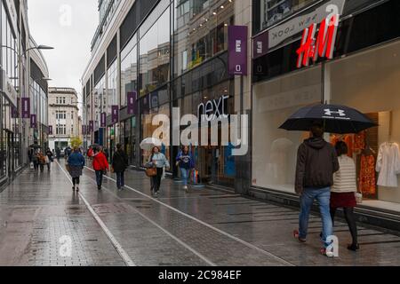 Cork, Ireland. 29th July, 2020. Heavy Rain in Cork City. There was a notacible lack of shoppers in Cork City today due to the heavy rain that fell throughout the day. While some did brave the rain many appeared to have stayed at home. Credit: Damian Coleman/Alamy Live News Stock Photo