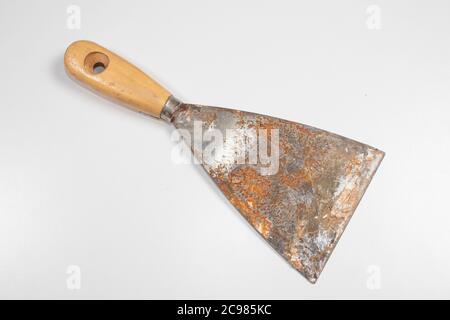 Metal spatula, trowel with plastic handle and two paint brush on white  background with copyspase. Brush and spatula - paint tools on a beige and  brigh Stock Photo - Alamy