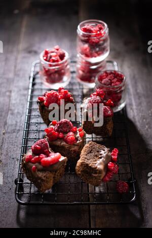 Chocolate raspberry cake.Dessert on a wooden table.Sweet cookie.Healthy food and drink. Stock Photo