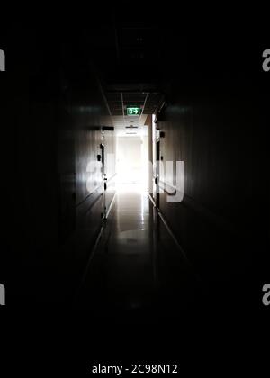 Dark corridors is very scary and Follow the fire exit signs, The way to the fire escape. Stock Photo