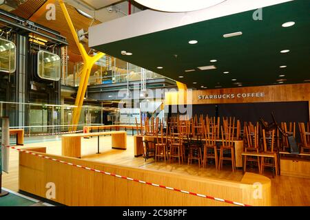 28th July 2020, Barajas Airport, Madrid, Spain: The closed Starbucks cafe in the departure lounge of the  Terminal 4S building of Barajas Airport. Reduced numbers of flights are operating between European countries, and governments have put a system of air bridges in place to facilitate travel and tourism. The economic impact of the virus on retail and other sectors will be severe, with many businesses still shut. Stock Photo