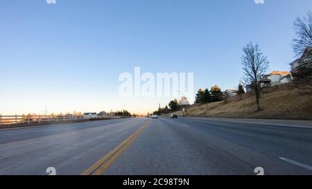 Driving on typical paved roads in suburban America. Stock Photo