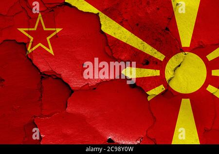 historical flag of Socialist Republic of Macedonia and today North Macedonia flag painted on cracked wall Stock Photo