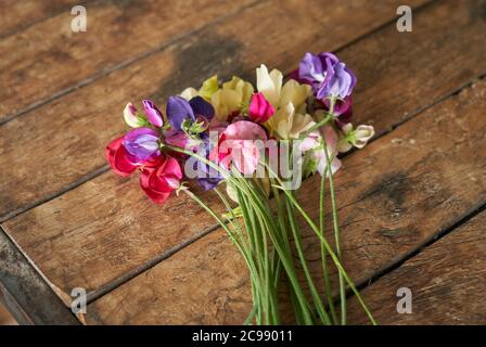 Flowers arranged on a table at Wedding lunch. Stock Photo