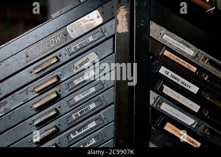 A letterpress printing workshop with letter cases on display Stock ...