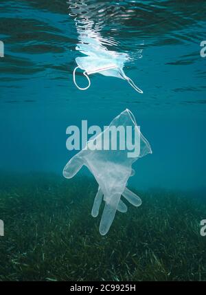 Plastic waste pollution underwater in the sea, glove and face mask, coronavirus COVID-19 pandemic, Mediterranean sea