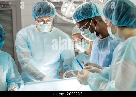 young interns watching the experiment in the hospital. close up photo Stock Photo