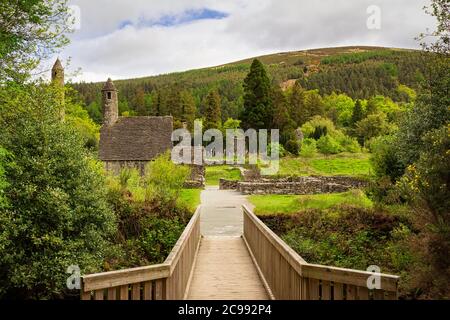 Entrance bridge to the archaeological site of Glendalough, in the Wiclow Mountains National Park, Ireland Stock Photo