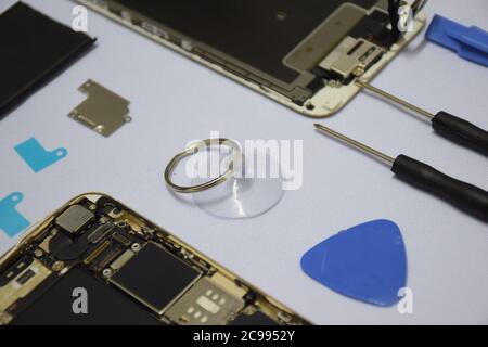 Soft focus to Tools for repairing smart phones on a white background - Change or replacement smart phones battery Stock Photo