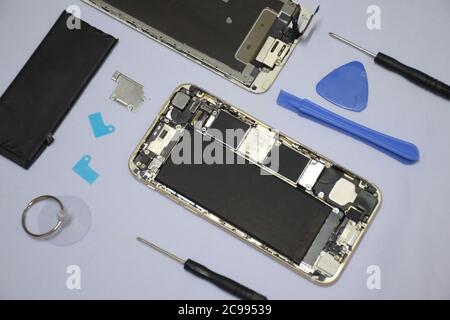 Soft focus to Tools for repairing smart phones on a white background - Change or replacement smart phones battery Stock Photo