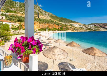 View of Kalkan beach from a seafront restaurant, Antalya province, Turkey Stock Photo