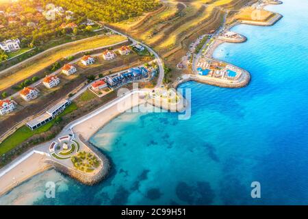 Aerial view of beautiful sandy beach and cottage town Stock Photo