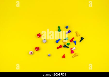 Dices and chips on a yellow background. Stock Photo