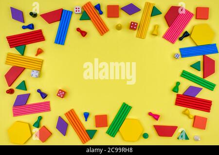 Geometric shapes, sticks for counting, chips and dice. Stock Photo