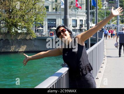 Beautiful young woman in Zürich city in Switzerland Stock Photo