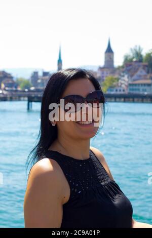 Beautiful young woman in Zürich city in Switzerland Stock Photo