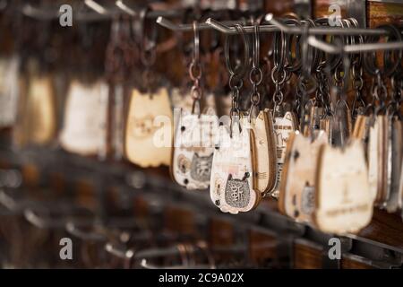 Yangshuo, China - August 2019 : Hanging small chinese key chain souvenirs for sale in souvenir shop Stock Photo