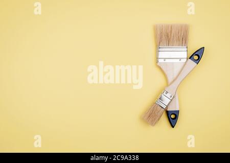 House painter tool on a yellow background.