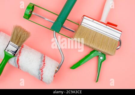 Green house painter tool on a pink background. Stock Photo