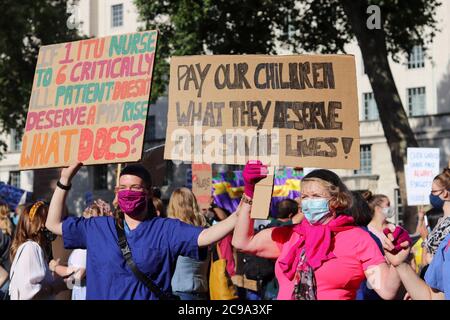 LONDON, ENGLAND, JULY 29 2020, NHS staff protest outside Downing Street after marching from St Thomas's Hospital at the 'March For Pay Justice for NHS and Key Workers' (Credit: Lucy North | MI News) Credit: MI News & Sport /Alamy Live News Stock Photo