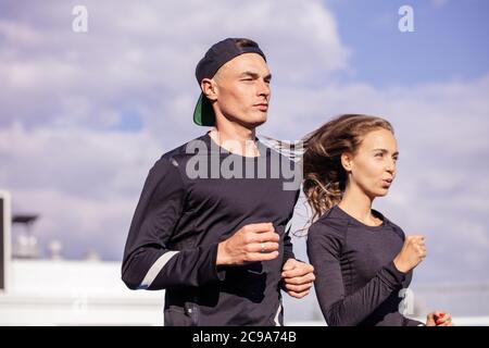 youth training outdoors. close up side view photo. copy space. willpower and strength concept. competitiveness Stock Photo