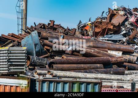 large pile of collected scrap metal for recycling on the territory of the metal collection point. Stock Photo