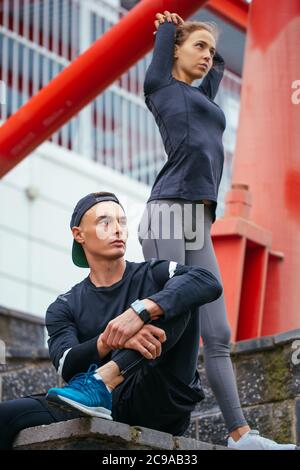 two ambitious runners having a rest after workout. free time. lifestyle Stock Photo