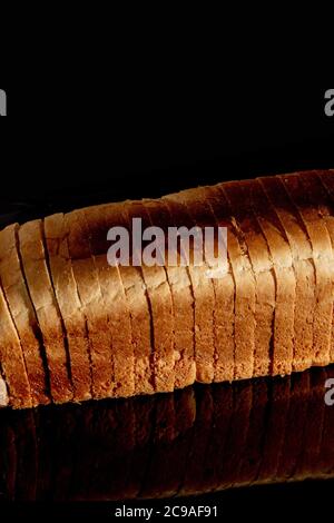 Sliced white bread isolated on black, clipping path included Stock Photo