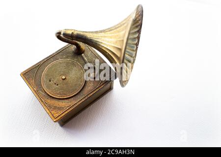 Premium Photo  Small indian girl looking through an vintage brass  gramophone speaker, isolated over white background