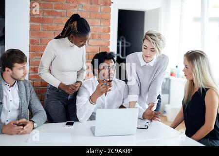 man and his team are thinking about problems in industry. close up photo. office workers analyzing the problems of the company Stock Photo