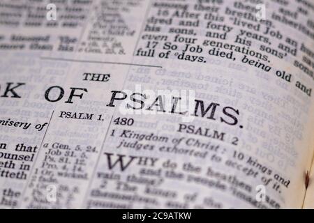 Bible open at the end of the Book of Job and the first page of the Book of Psalms of Psalms; Psalm Number Two Stock Photo