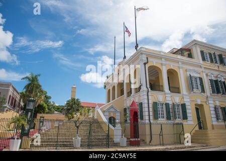 Christiansted, St. Croix, USVI-October 22,2019: Old Government House with flag array in downtown area of St. Croix in the USVI Stock Photo