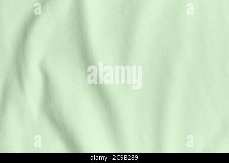 Texture and background of crumpled turquoise fabric. Stock Photo