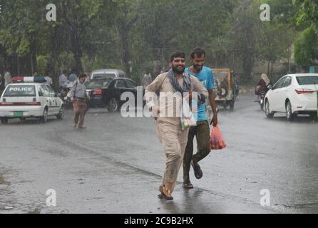 Lahore, Pakistan. 29th July, 2020. Pakistani motorists are on their way during the monsoon rain spell in Lahore. (Photo by Rana Sajid Hussain/Pacific Press) Credit: Pacific Press Media Production Corp./Alamy Live News Stock Photo