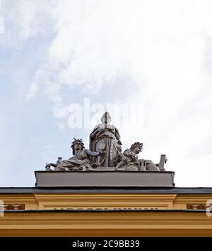 Sundsvall, Norrland Sweden - July 14, 2020: statues with antique motifs on the roof of an old stone house Stock Photo