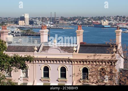 View of terrace houses in the foreground looking across the western side of Sydney harbour to Balmain, New South Wales, Australia. Stock Photo
